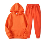 Oversized women's hooded sweatshirt and jogger lounge set by Plush Fashion Hub made of soft, sparkling polyester fabric.