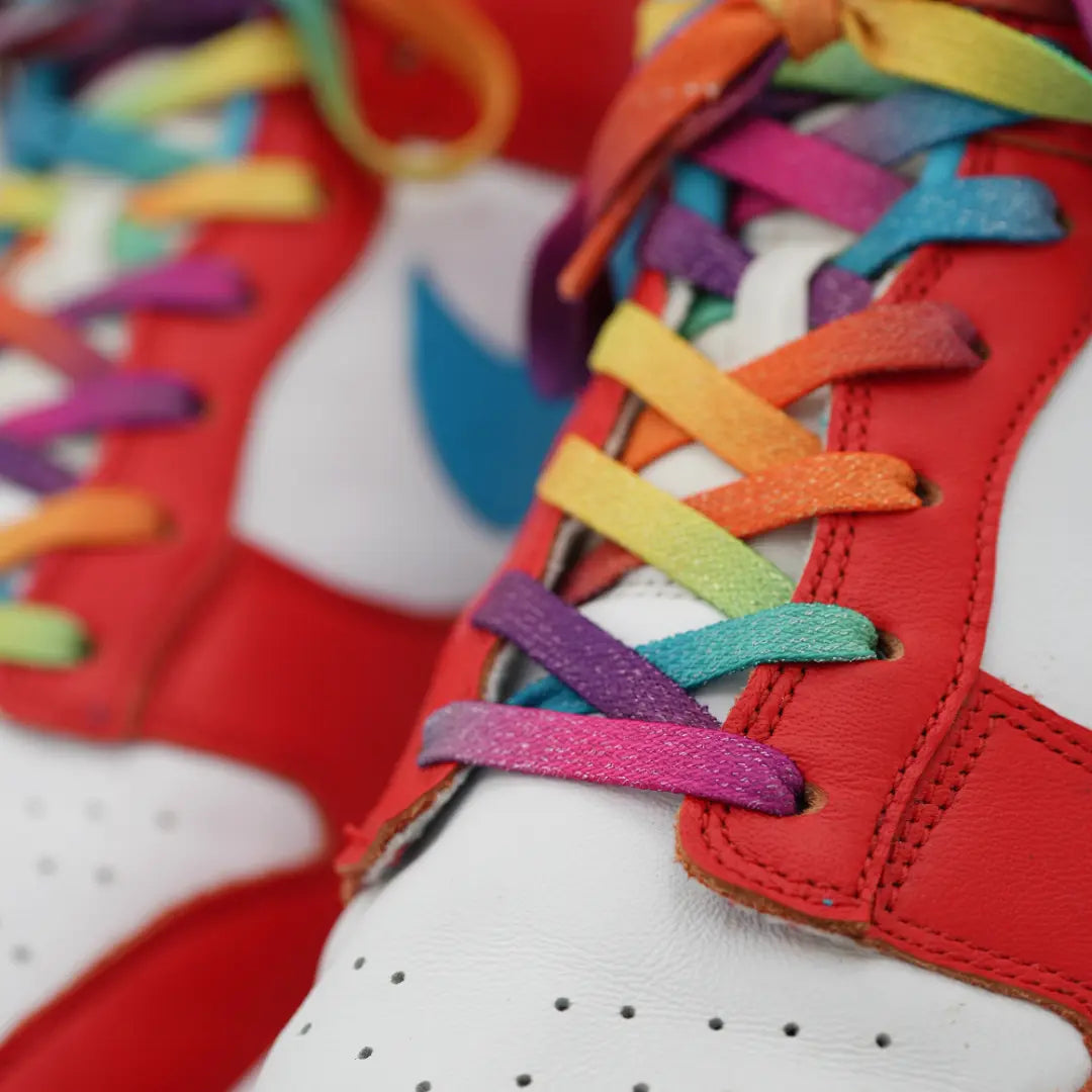Close-up of Prime Rainbow elastic shoelace by Plush Fashion Hub, featuring sparkly rainbow colors and flexible, stretchy material.