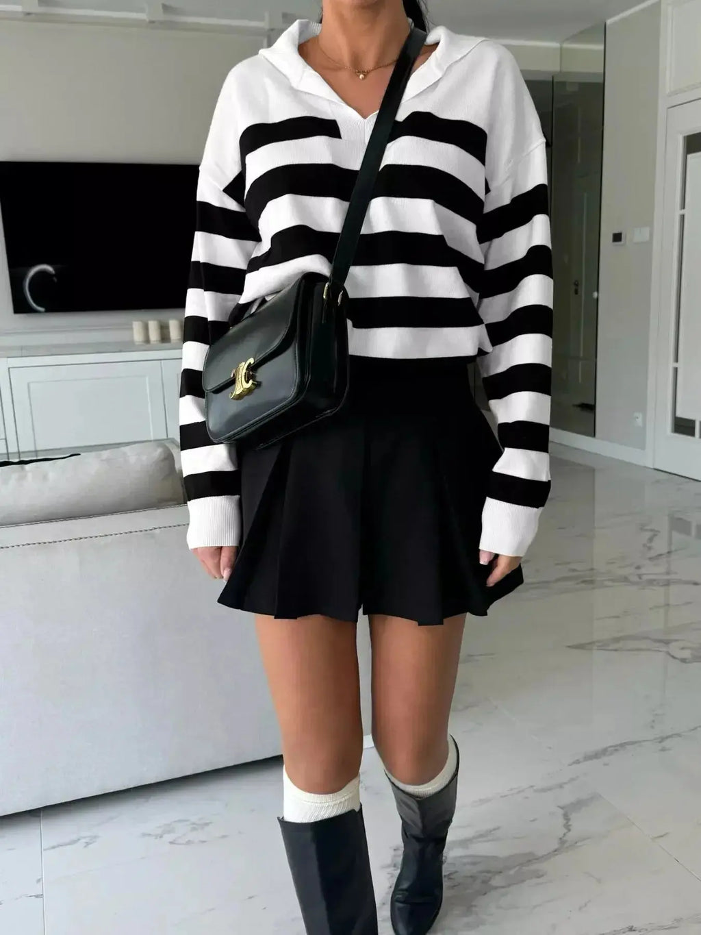 Women's striped dropped shoulder knit sweater top by Plush Fashion Hub, featuring long sleeves and casual style.