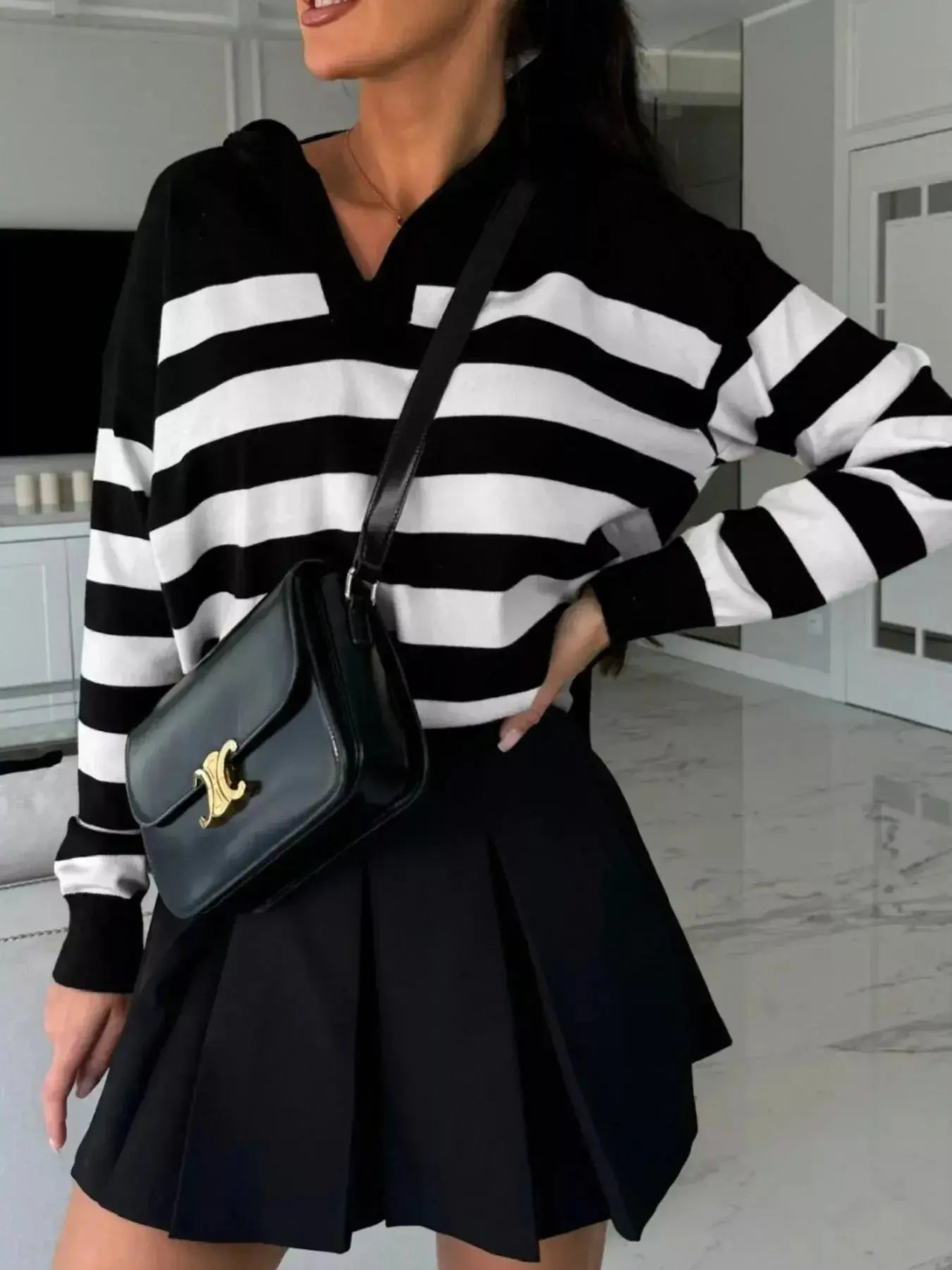 Women's striped dropped shoulder knit sweater top with long sleeves, casual and stylish by Plush Fashion Hub.