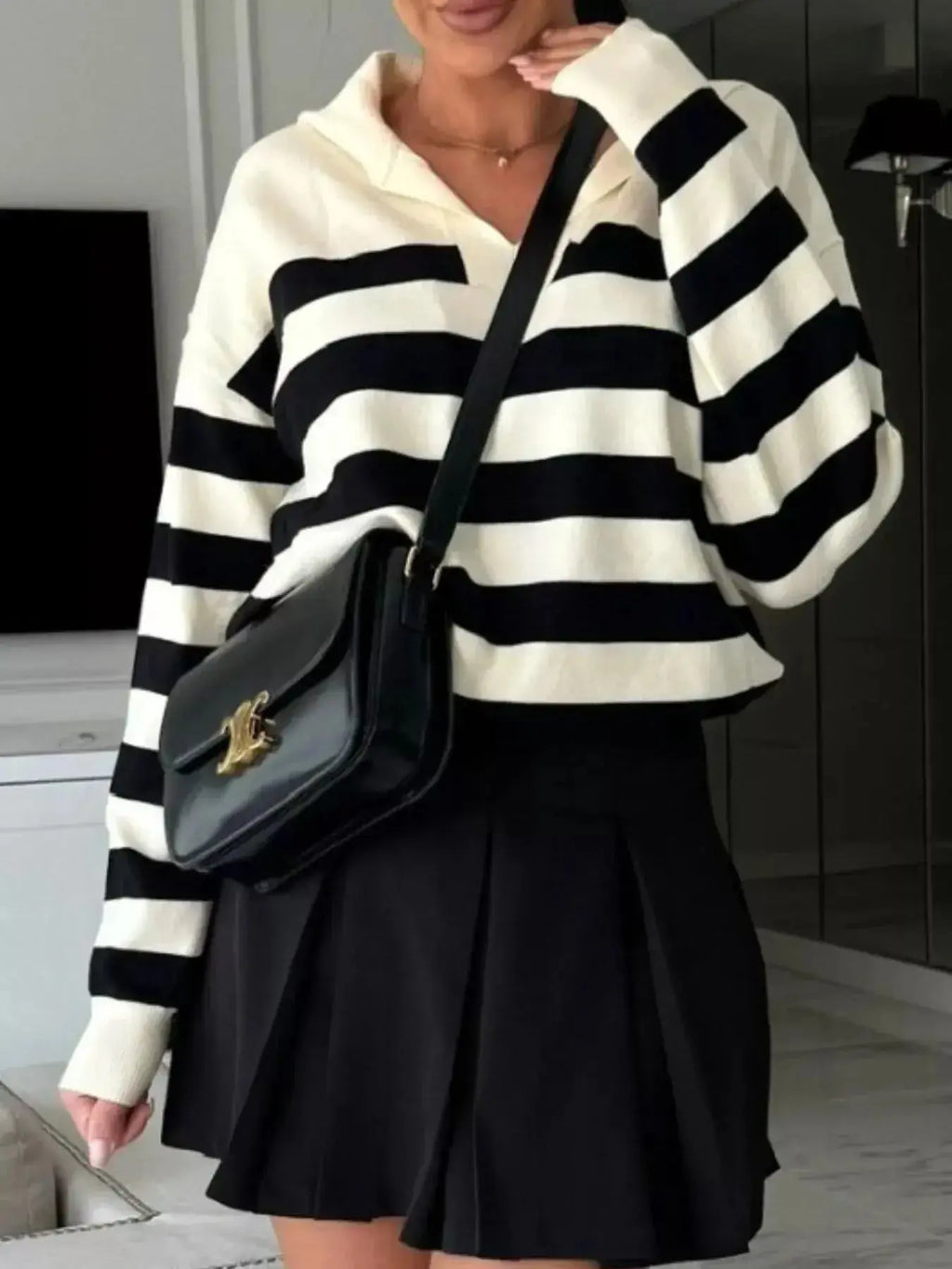 Women's striped dropped shoulder knit sweater top from Plush Fashion Hub, featuring long sleeves and casual style.