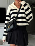 Women's striped dropped shoulder knit sweater top from Plush Fashion Hub, featuring long sleeves and casual style.