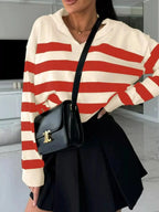 Women's striped dropped shoulder knit sweater top from Plush Fashion Hub, featuring casual long sleeves and a relaxed fit.