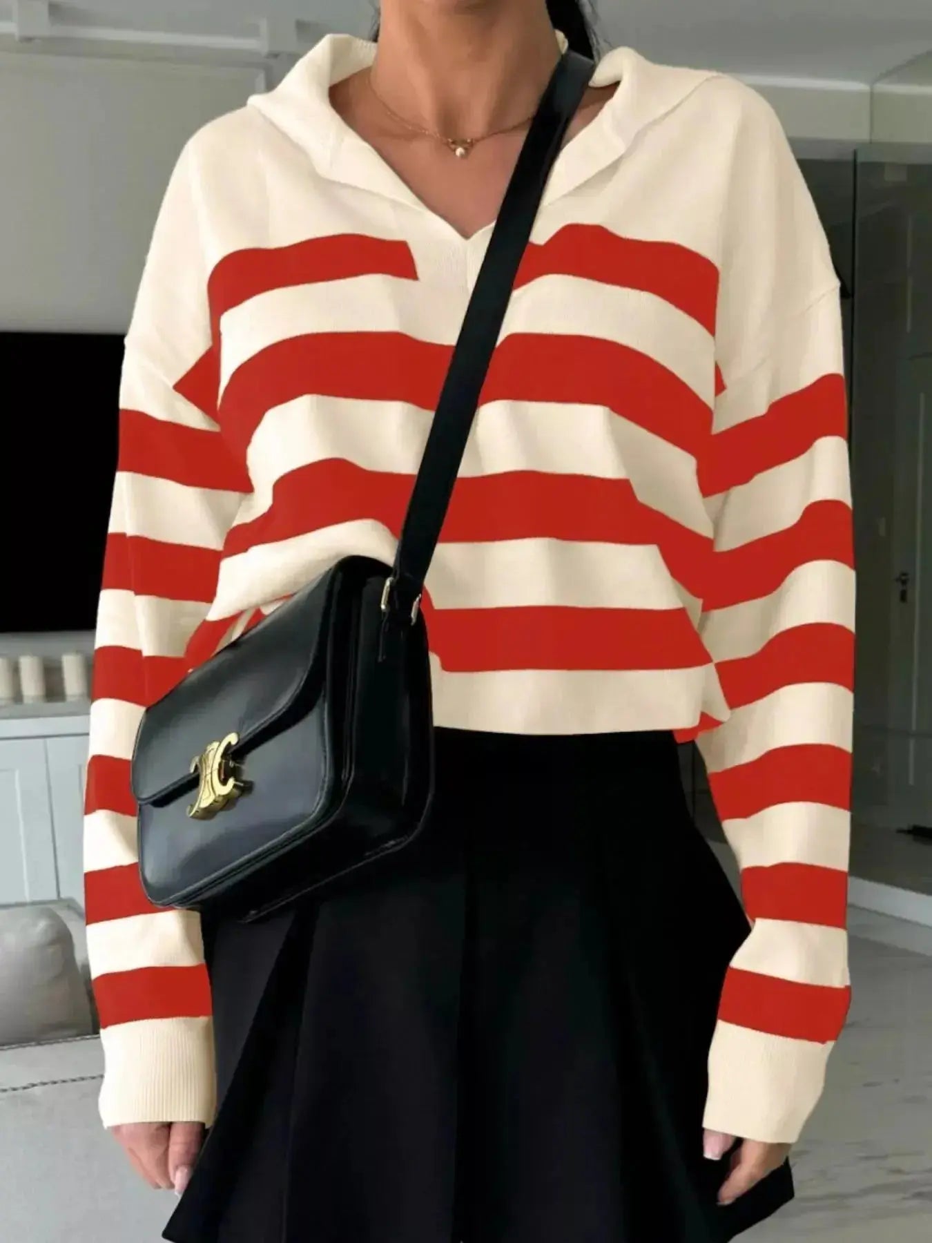 Women's striped dropped shoulder knit sweater top with long sleeves, casual and comfortable by Plush Fashion Hub.