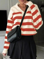 Women's striped dropped shoulder knit long sleeve sweater top by Plush Fashion Hub, featuring casual style and relaxed fit.