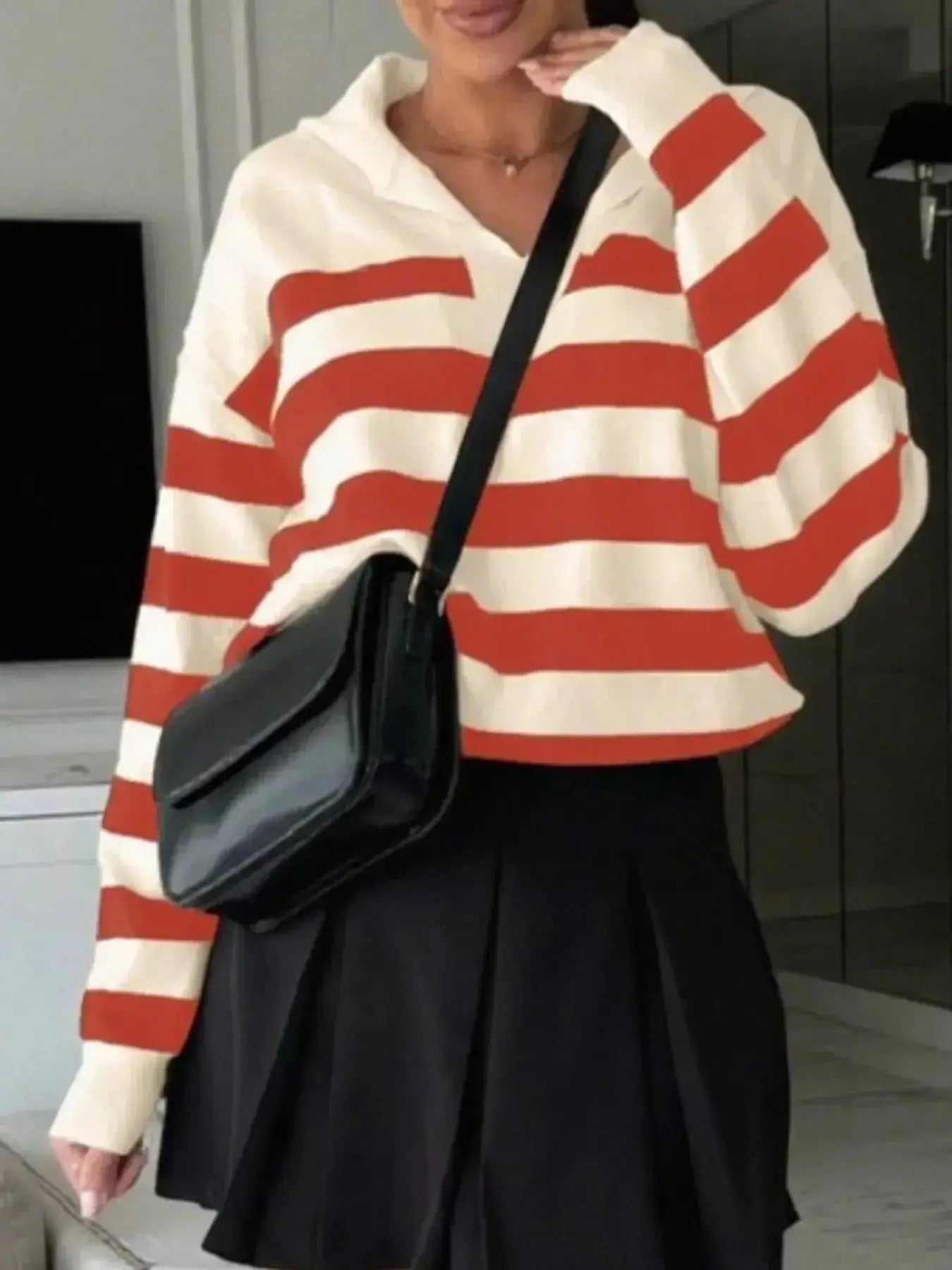 Women's striped dropped shoulder knit long sleeve sweater top by Plush Fashion Hub, featuring casual style and relaxed fit.