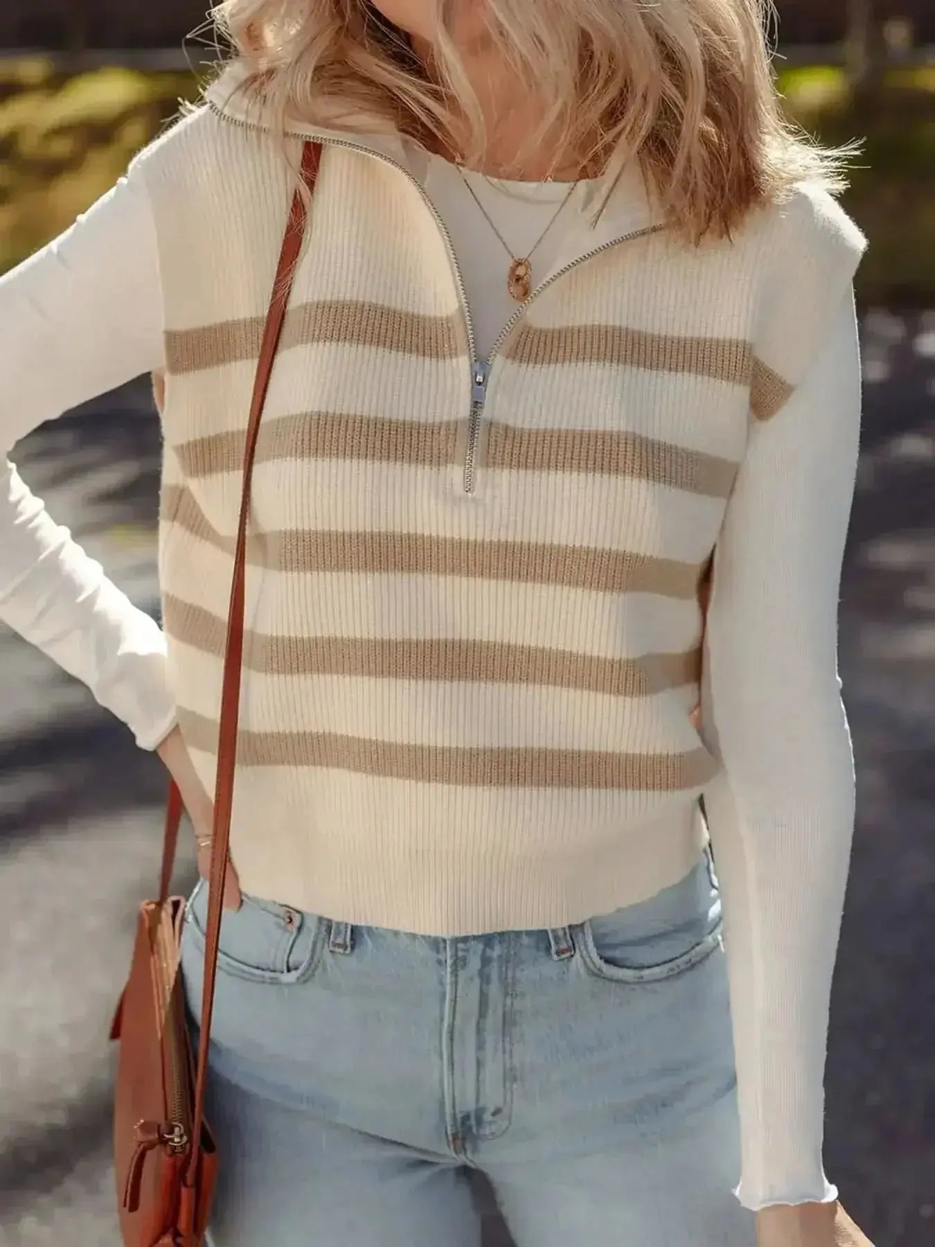 Striped sleeveless ribbed knit sweater vest with half-zip and mock neck from Gilded Glamour Shop, perfect for layered fashion.