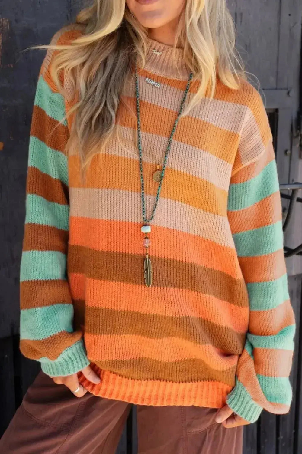 Women's rainbow striped long sleeve knit sweater with soft crewneck, from Plush Fashion Hub, cozy and stylish pullover.