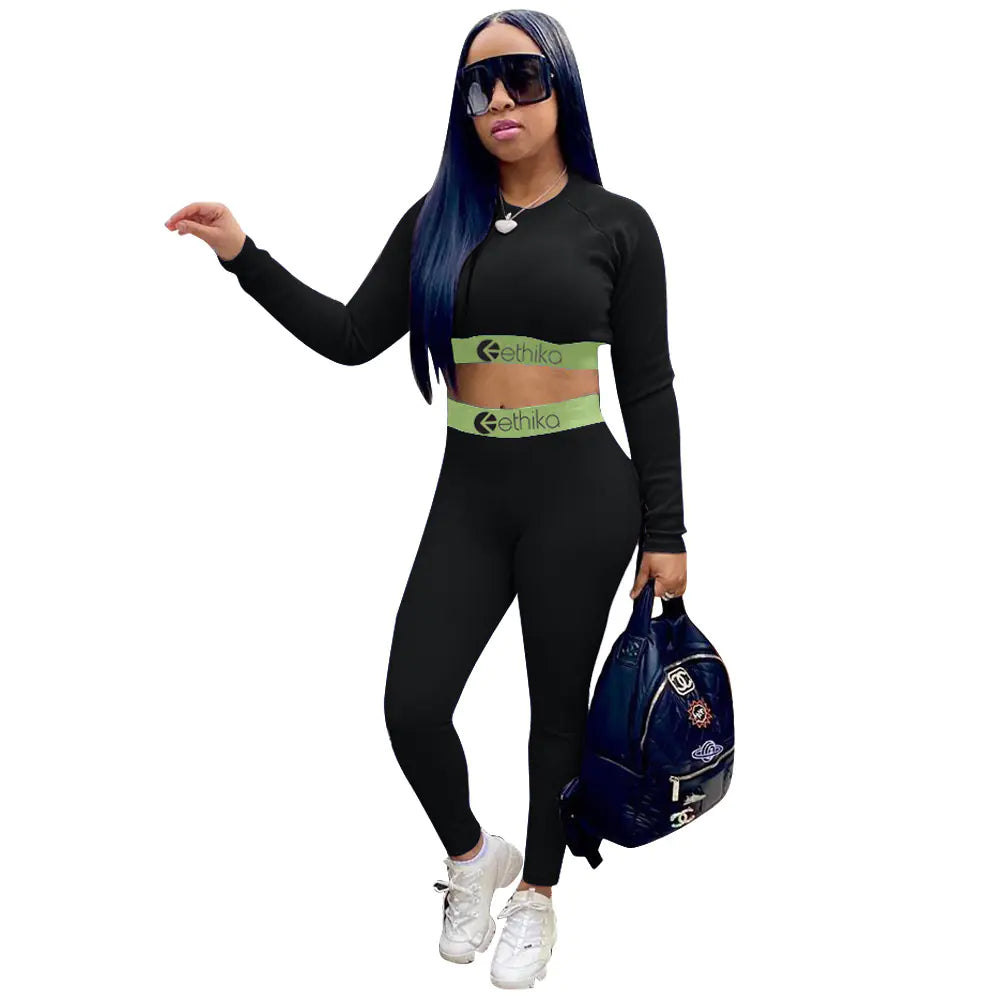 Women's two-piece sports set with letter print, featuring comfortable fabric and sporty style from Trendy Attic Store01.