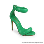 Green Plush Fashion Hub Tisha-112 heels shown from an angle, featuring stylish design and pointed toe on a neutral background.