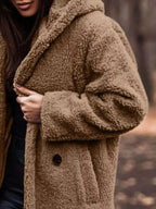 Lightweight plush teddy bear longline hooded jacket from Plush Fashion Hub, soft and cozy outerwear with a plush texture.