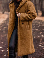 Lightweight plush teddy bear longline hooded jacket from Plush Fashion Hub, soft and cozy outerwear for chilly days.