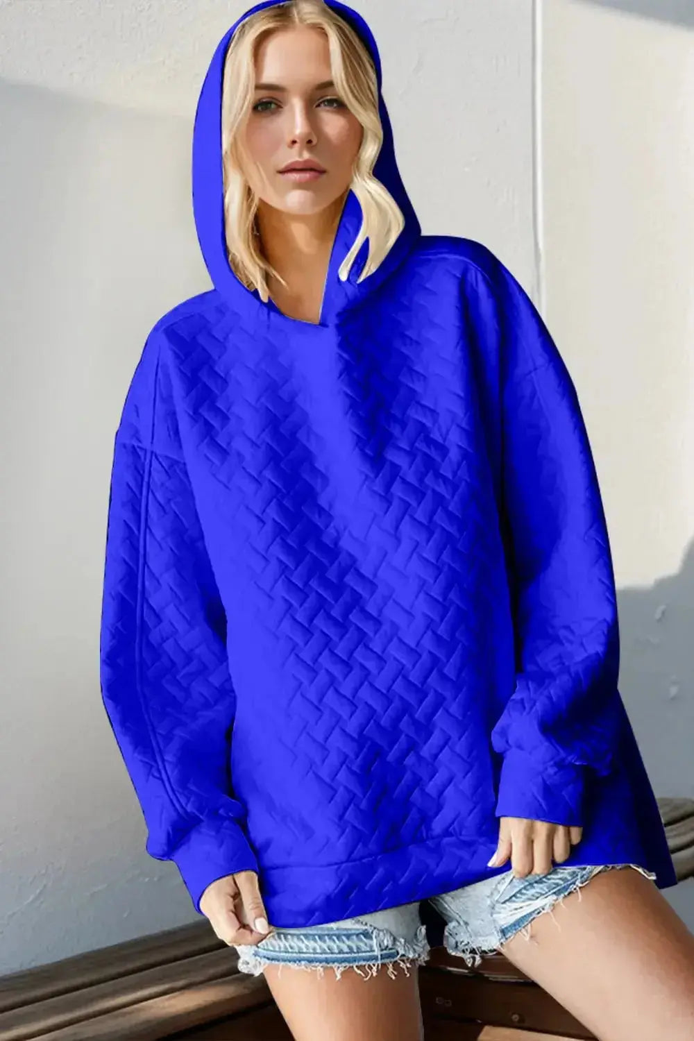 Textured drop shoulder long sleeve hoodie sweater by Trendsi, plush fabric with relaxed fit and cozy style.