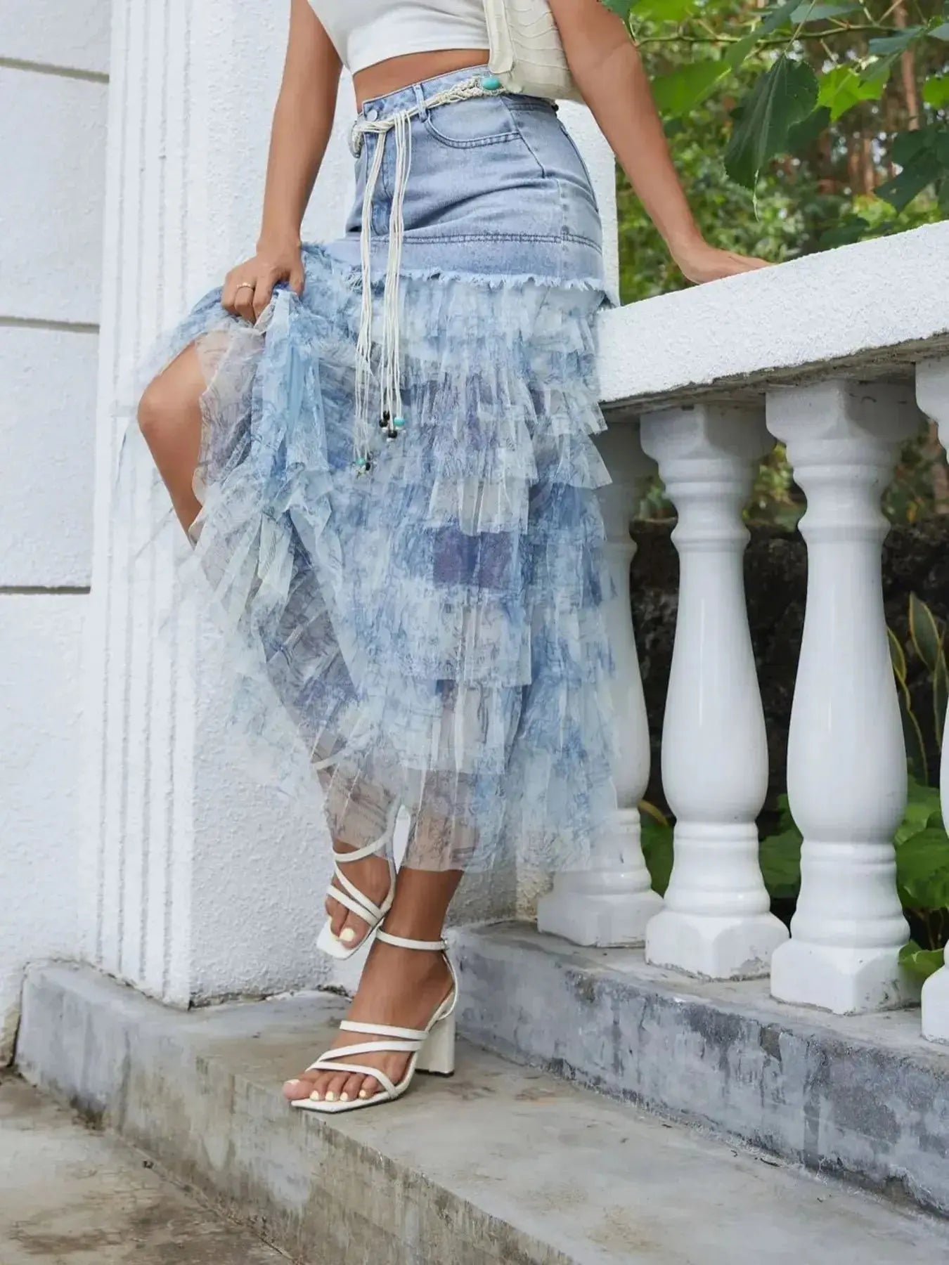 Blue denim tiered ruffle patchwork skirt with a matching belt, stylishly designed by Trendsi for a trendy fashion look.