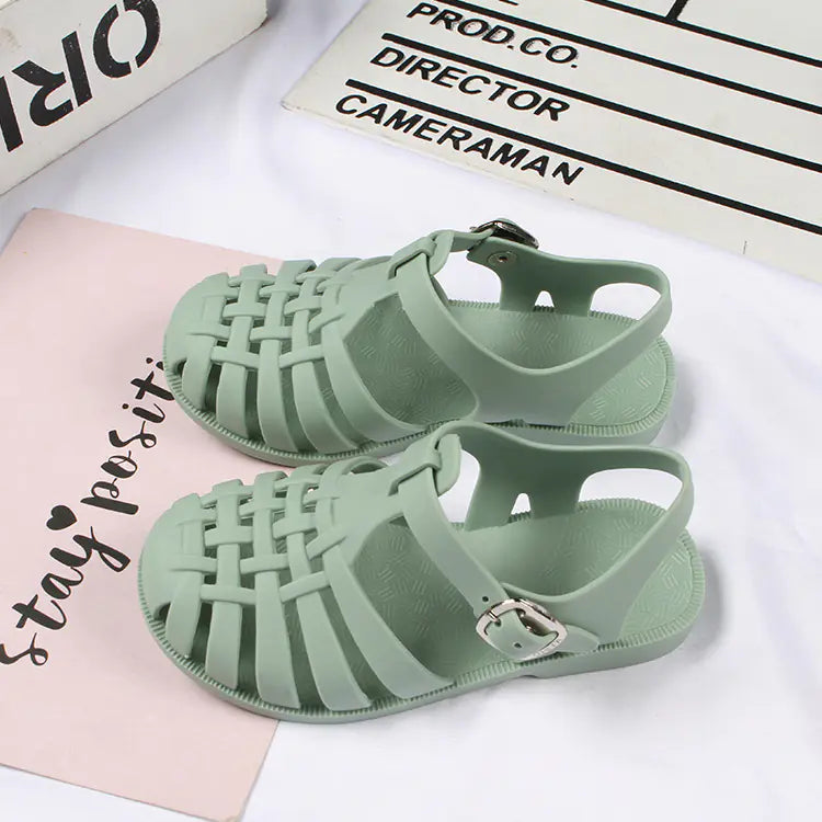 Girls hollow casual flat sandals in pink with open toe design, lightweight and comfortable for everyday wear by Trendy Attic Store01.