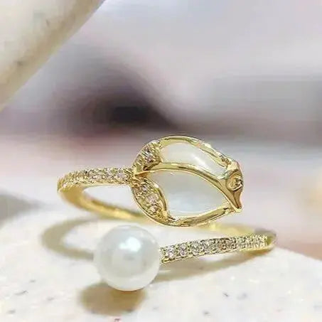 Elegant tulip bud pearl ring by Plush Fashion Hub featuring a floral design and adjustable band for stylish statement jewelry.