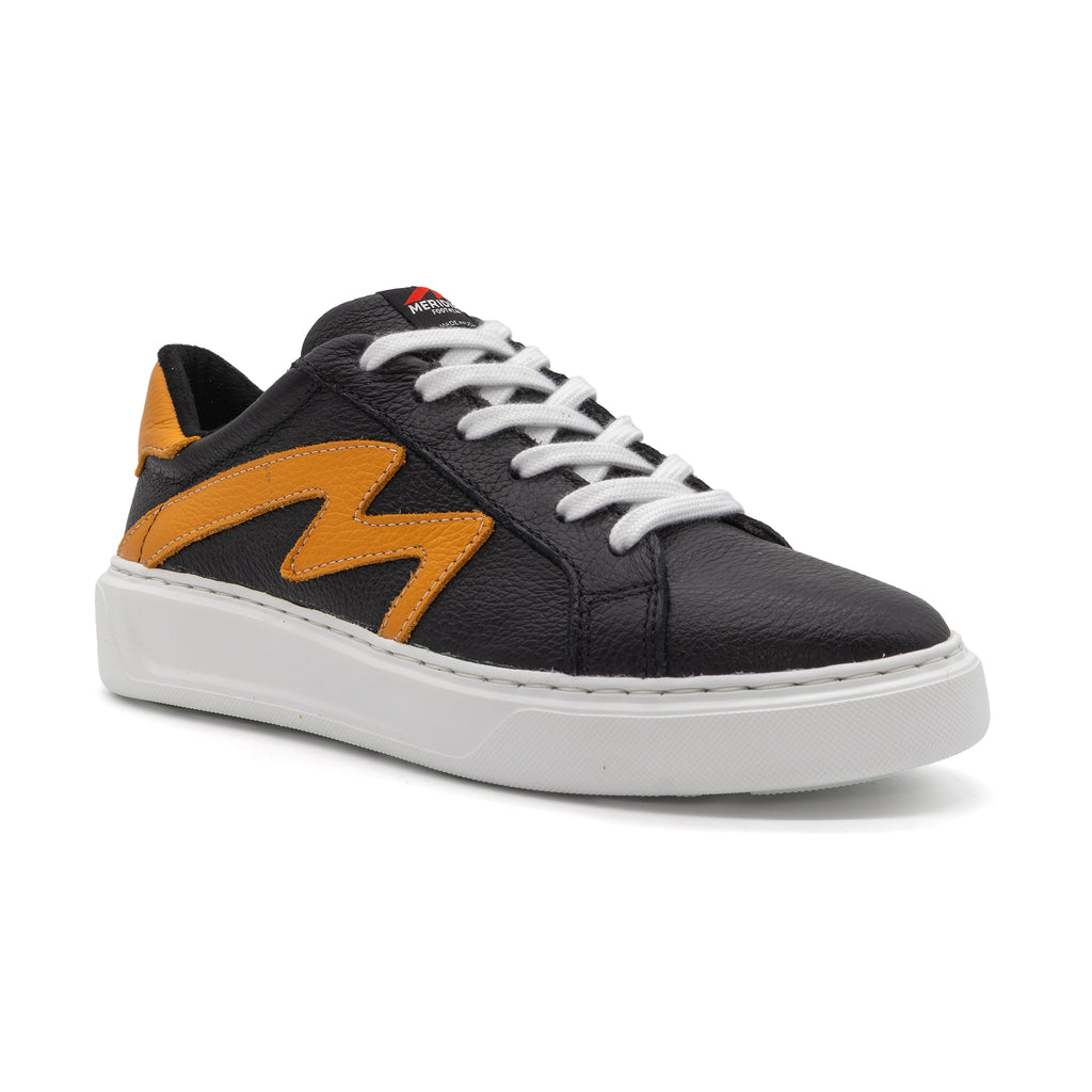 Black and gold two-tone low-top sneakers by BLKSWN Footwear shown from an angled view.