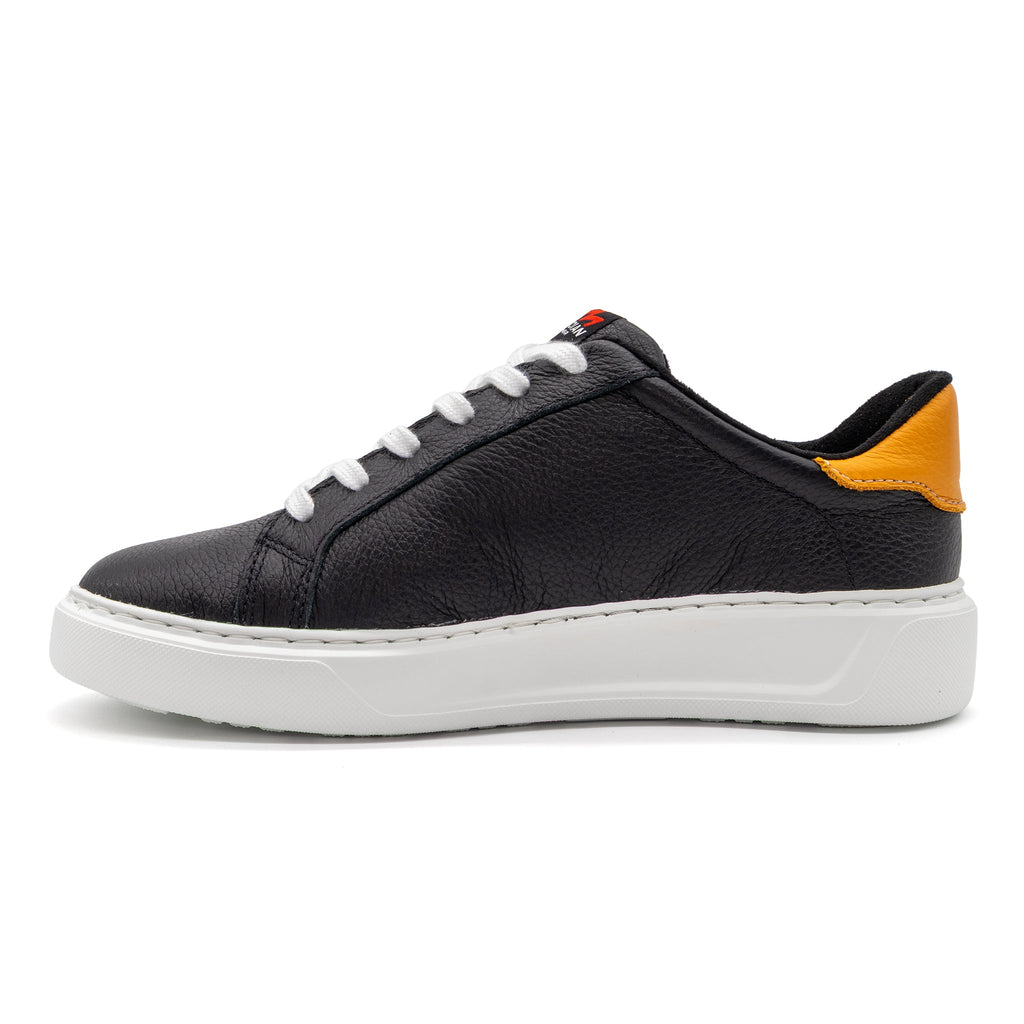 Black and gold two-tone lowtop sneaker by BLKSWN Footwear, showing the left side of the stylish design.