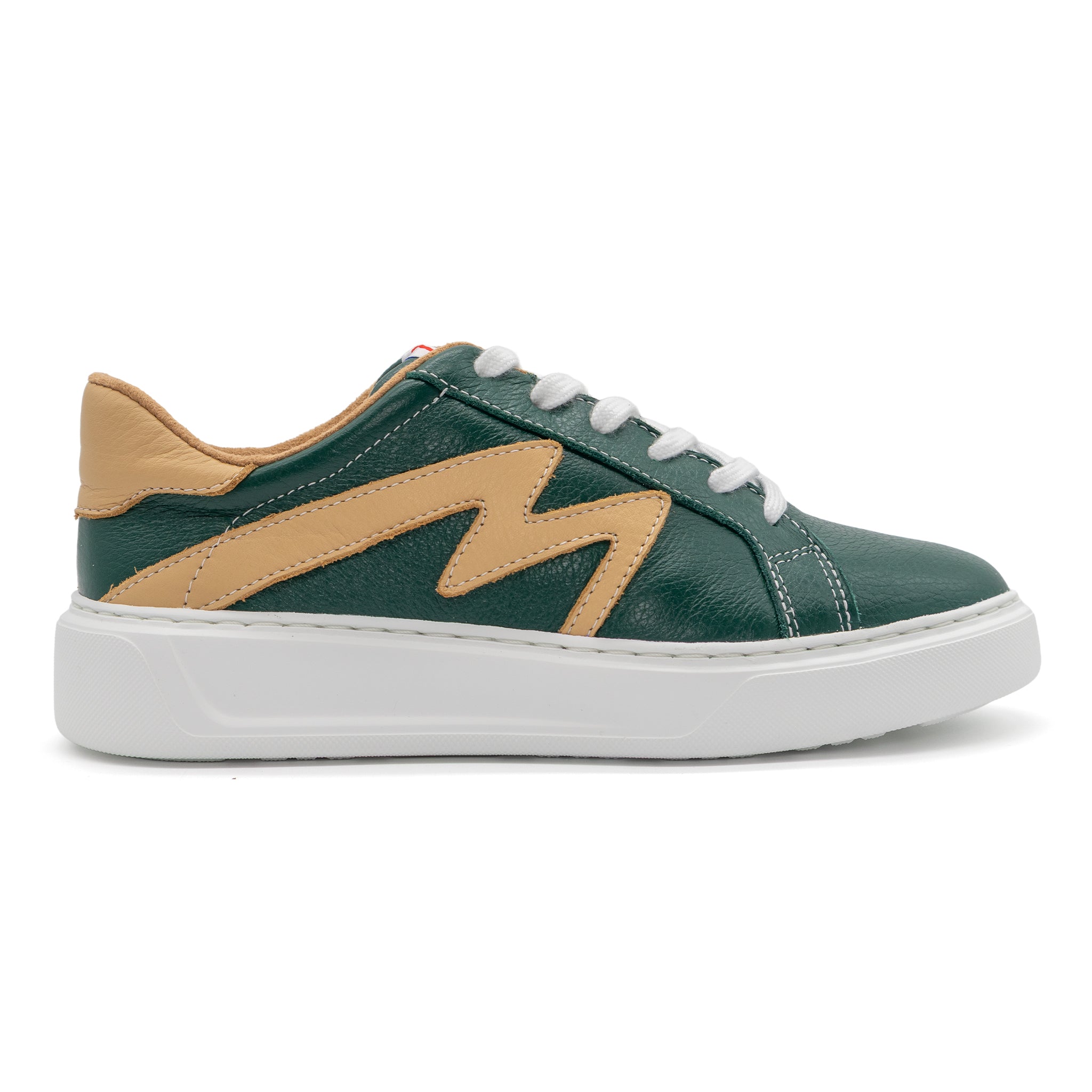 Right foot of BLKSWN Footwear 601 Two-Tone lowtop sneaker in forest green and old gold with a stylish two-tone design.