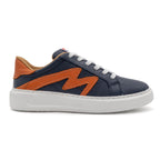 Right foot of BLKSWN Footwear 601 Two-Tone lowtop sneaker in navy and burnt orange, showing the stylish two-tone design.
