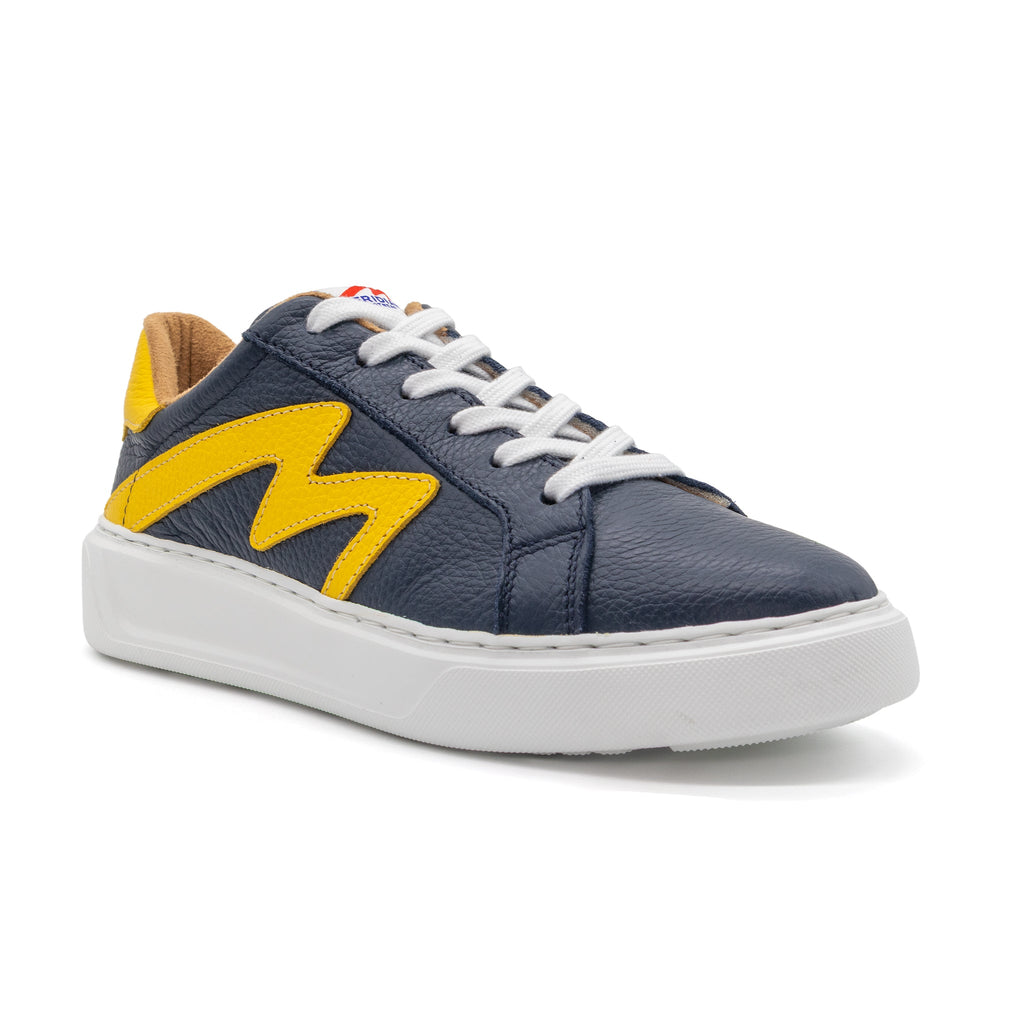 Lowtop BLKSWN Footwear sneakers in navy and yellow two-tone design, shown from an angled view.