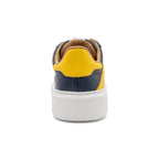 BLKSWN Footwear 601 Two-Tone navy and yellow lowtop sneaker shown from the back, highlighting the two-tone design and heel details.