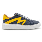 Right foot of BLKSWN Footwear 601 Two-Tone lowtop sneaker in navy and yellow, featuring a stylish two-tone design.