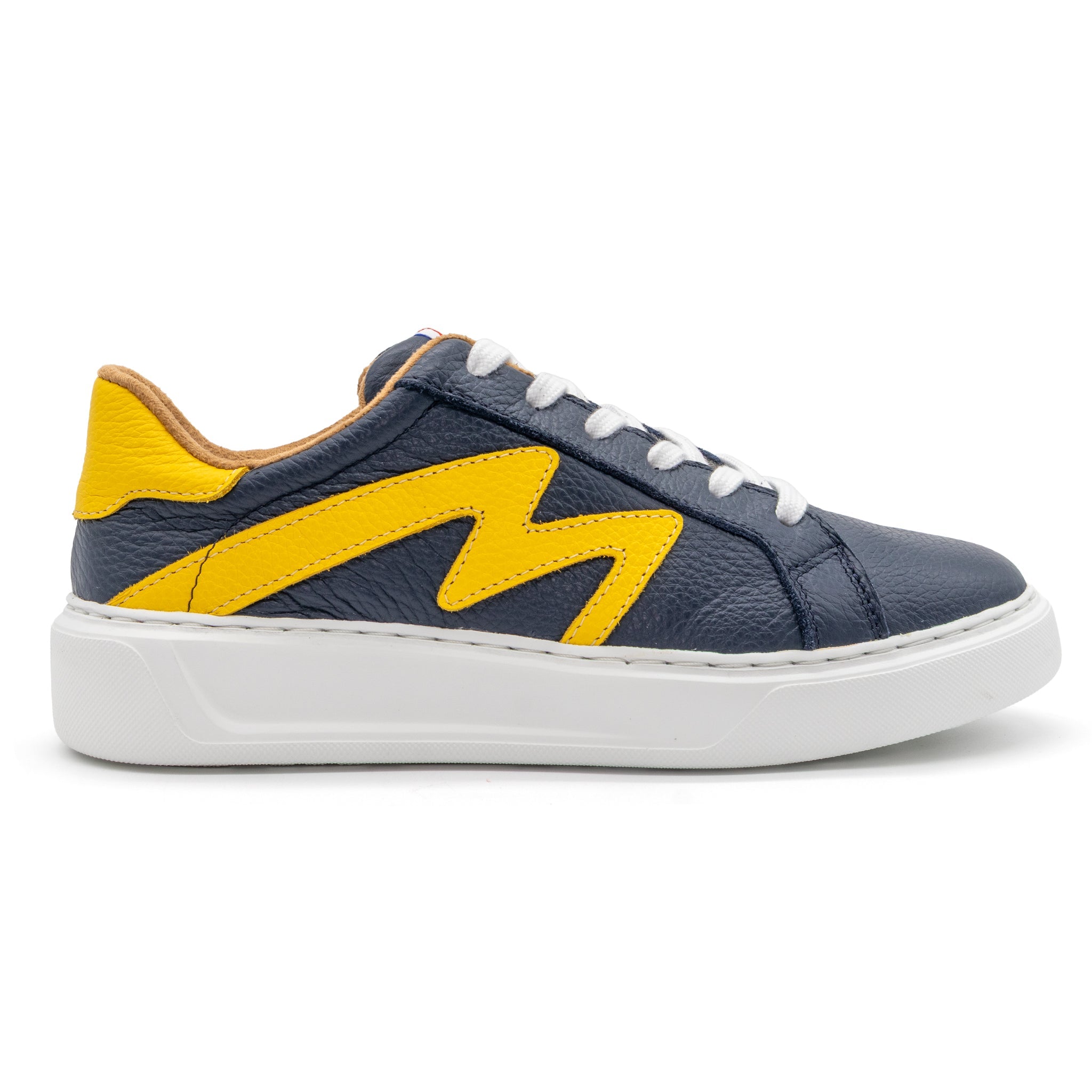 Right foot of BLKSWN Footwear 601 Two-Tone lowtop sneaker in navy and yellow, featuring a stylish two-tone design.