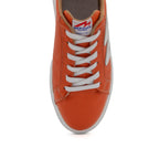 BLKSWN Footwear 601 Two-Tone lowtop sneakers in orange and white with a sleek design and comfortable fit.