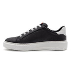 Black and white two-tone lowtop sneakers from BLKSWN Footwear, showcasing stylish design and contrasting color details.