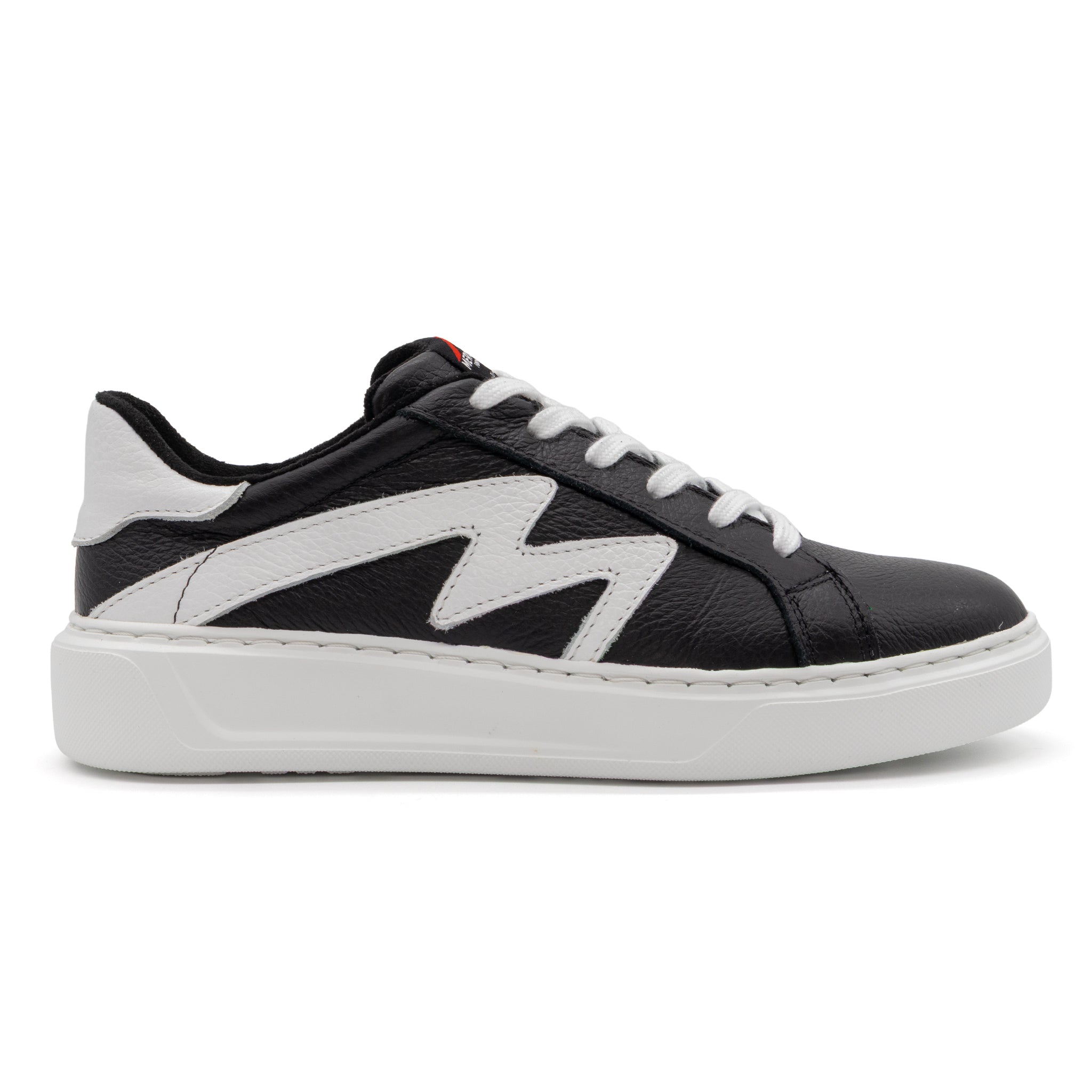 Black and white two-tone lowtop sneaker by BLKSWN Footwear, showing the right side of the stylish casual shoe.