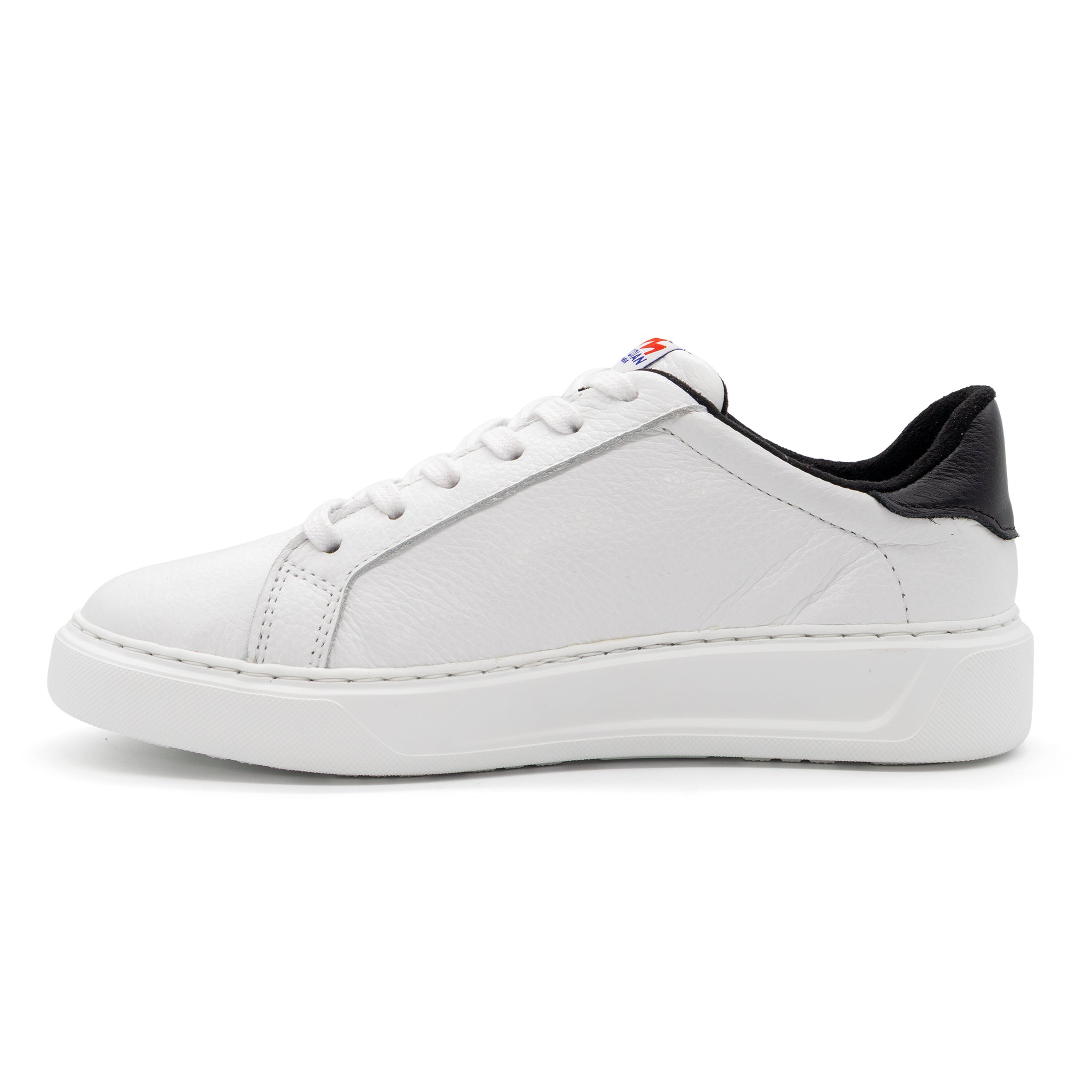 Black and white two-tone lowtop sneakers by BLKSWN Footwear, displayed from the left side.