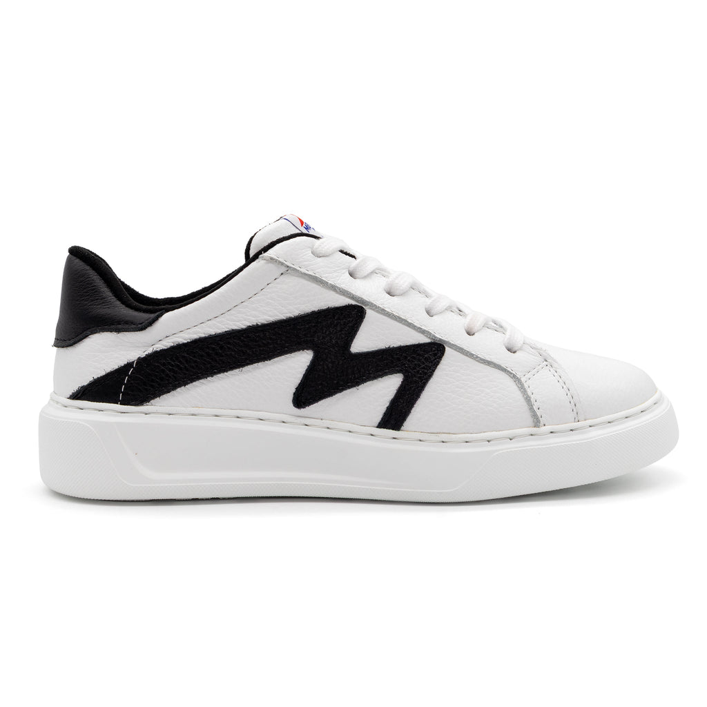 Right foot of BLKSWN Footwear 601 Two-Tone lowtop sneaker in white and black with a sleek design.
