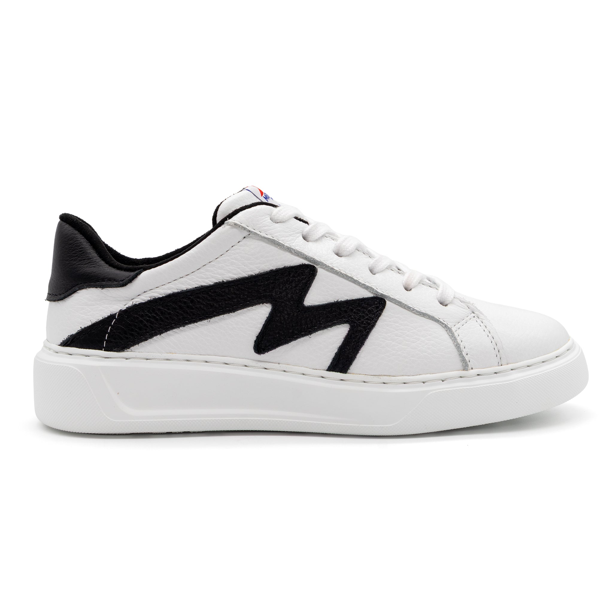 Right foot of BLKSWN Footwear 601 Two-Tone lowtop sneaker in white and black with a sleek design.