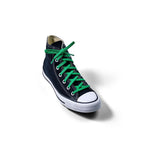 Green elastic shoelace by Bread, labeled Lucky Green, shown with close-up detail of the stretchy, flexible material and secure aglets.