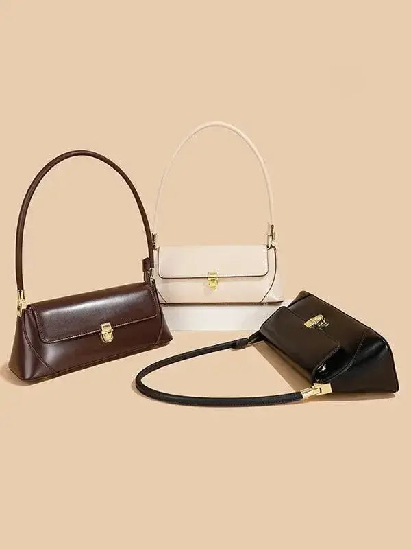 Urban solid leather zip-up shoulder bag with minimalist design, crossbody style, by Plush Fashion Hub.