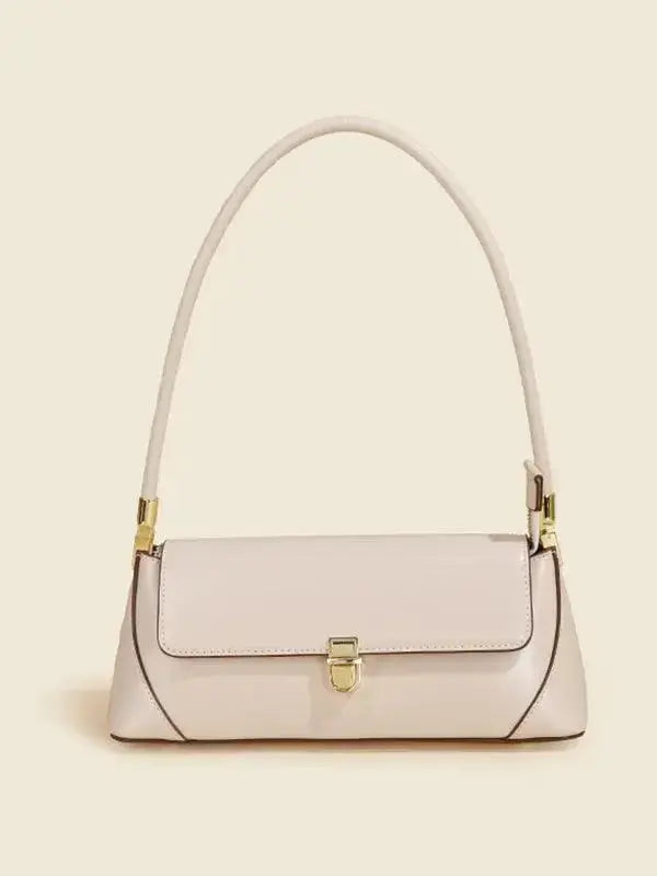 Urban solid leather shoulder bag with minimalist design, zip-up closure, and crossbody style from Plush Fashion Hub.