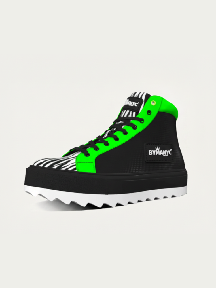 Black vegan ankle boot with green trim, zebra print toe, and thick black-and-white lug sole.