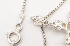 Vintage cubic zirconia cross sterling silver necklace with detailed pendant, crafted by Plush Fashion Hub.