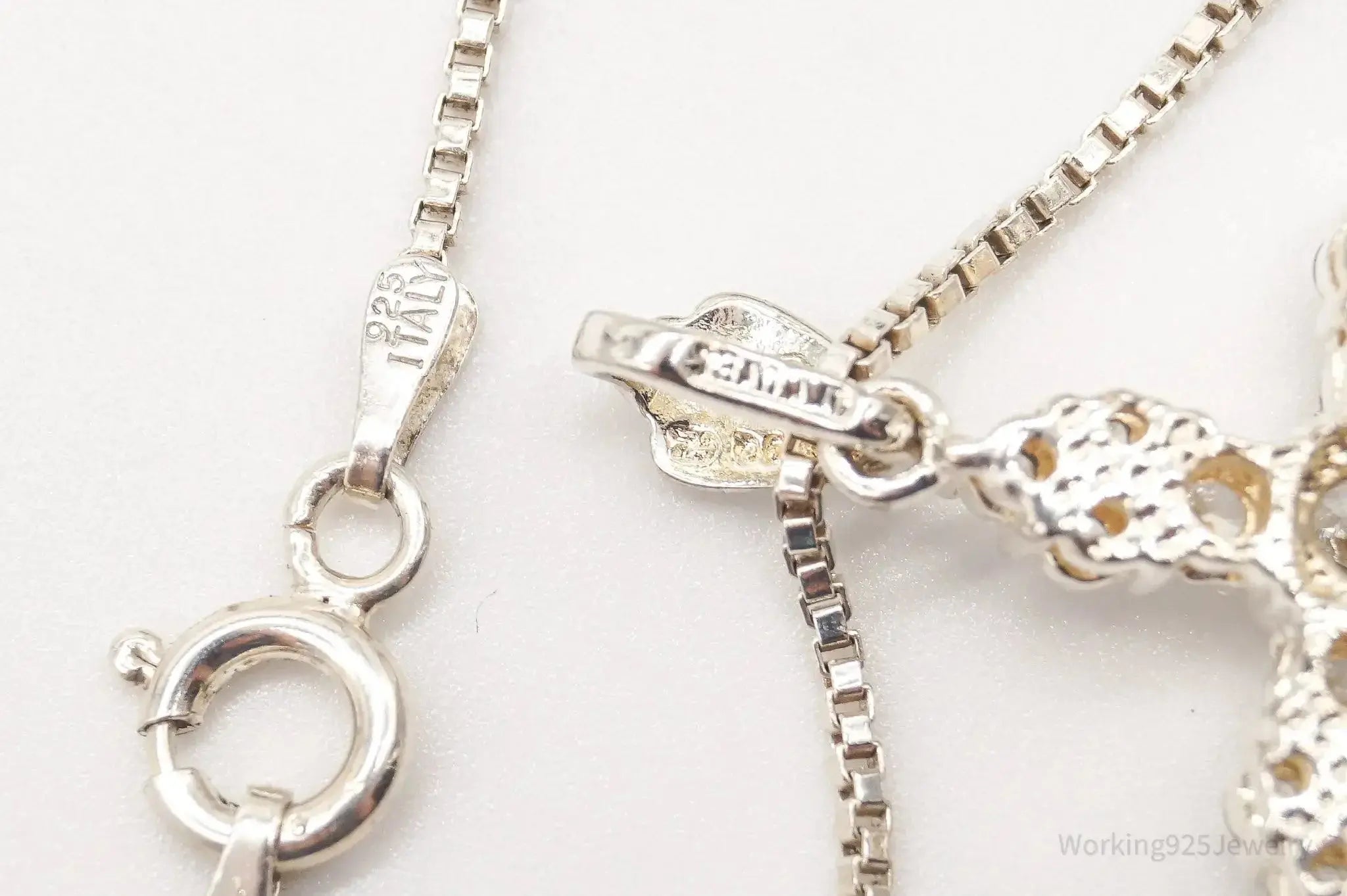 Vintage cubic zirconia cross sterling silver necklace with detailed pendant, crafted by Plush Fashion Hub.