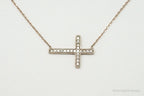Vintage cubic zirconia rose gold vermeil sterling silver cross necklace, jewelry pendant with sparkling stones and intricate design.