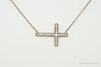 Vintage cubic zirconia rose gold vermeil sterling silver cross necklace, jewelry pendant with intricate design.