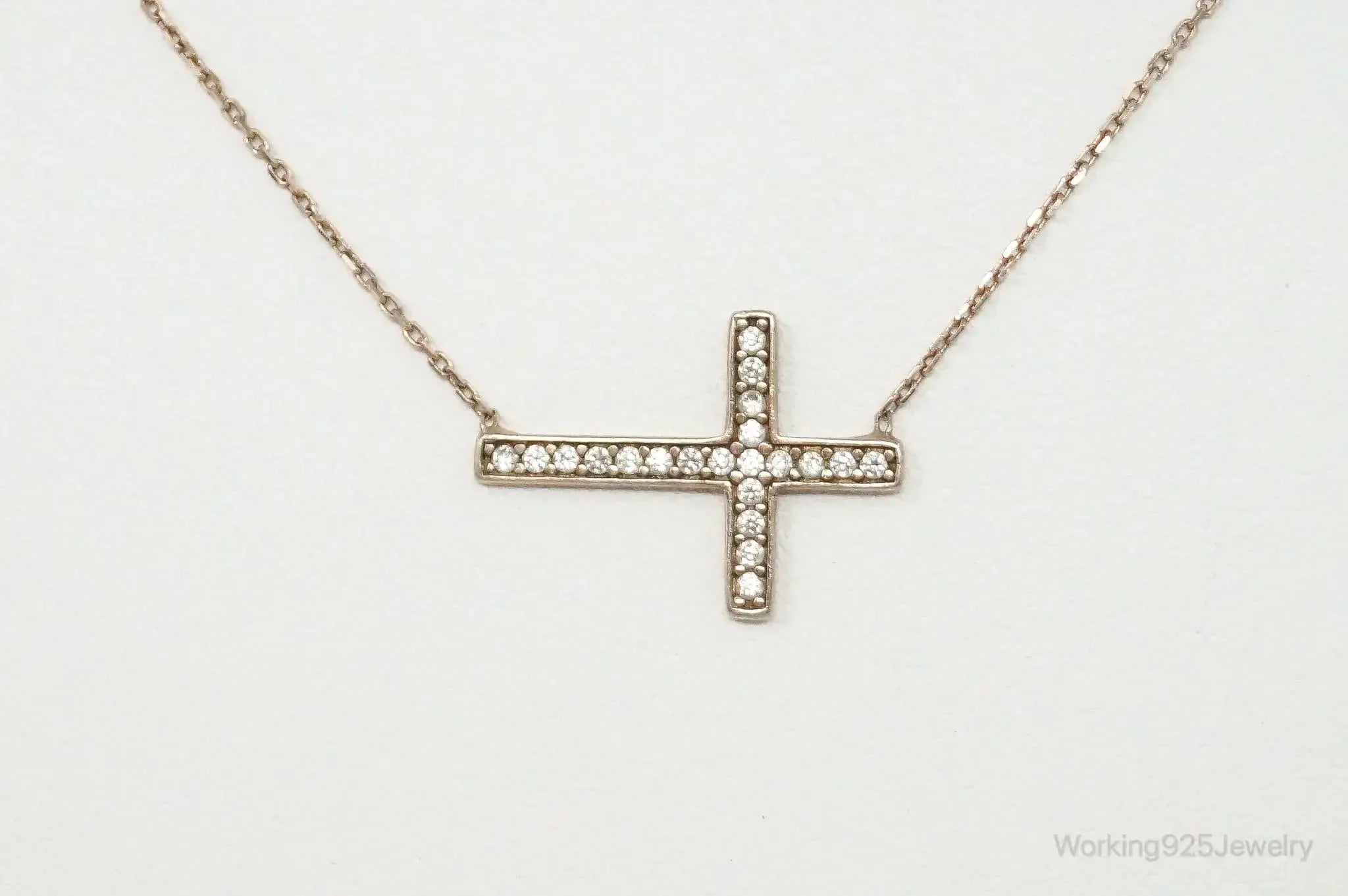 Vintage cubic zirconia rose gold vermeil sterling silver cross necklace, jewelry pendant with intricate design.