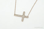 Vintage cubic zirconia rose gold vermeil sterling silver cross necklace with pendant, jewelry accessory featuring elegant design.