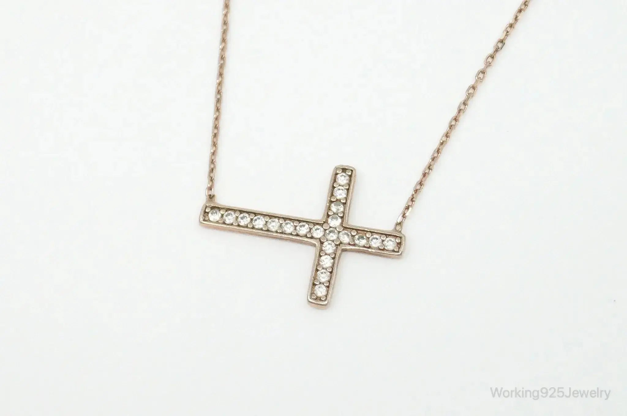 Vintage cubic zirconia rose gold vermeil sterling silver cross necklace with pendant, jewelry accessory featuring elegant design.