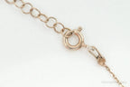 Vintage cubic zirconia rose gold vermeil sterling silver cross necklace with intricate pendant design, perfect for elegant jewelry styles.