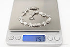 Vintage cubic zirconia sandals and flowers sterling silver bracelet, elegant jewelry set with detailed silver and sparkling stones.