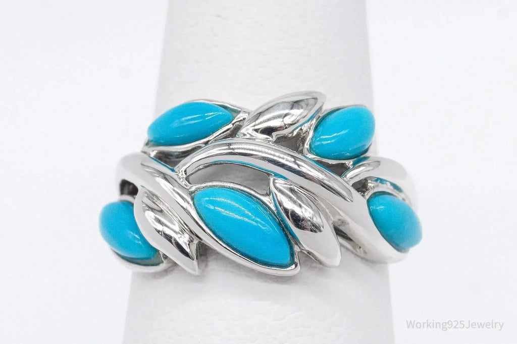 Vintage EA turquoise sterling silver ring, size 5, featuring a bold turquoise stone set in intricate silver detailing.