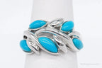 Vintage EA turquoise sterling silver ring, size 5, featuring a bold turquoise stone set in intricate silver detailing.