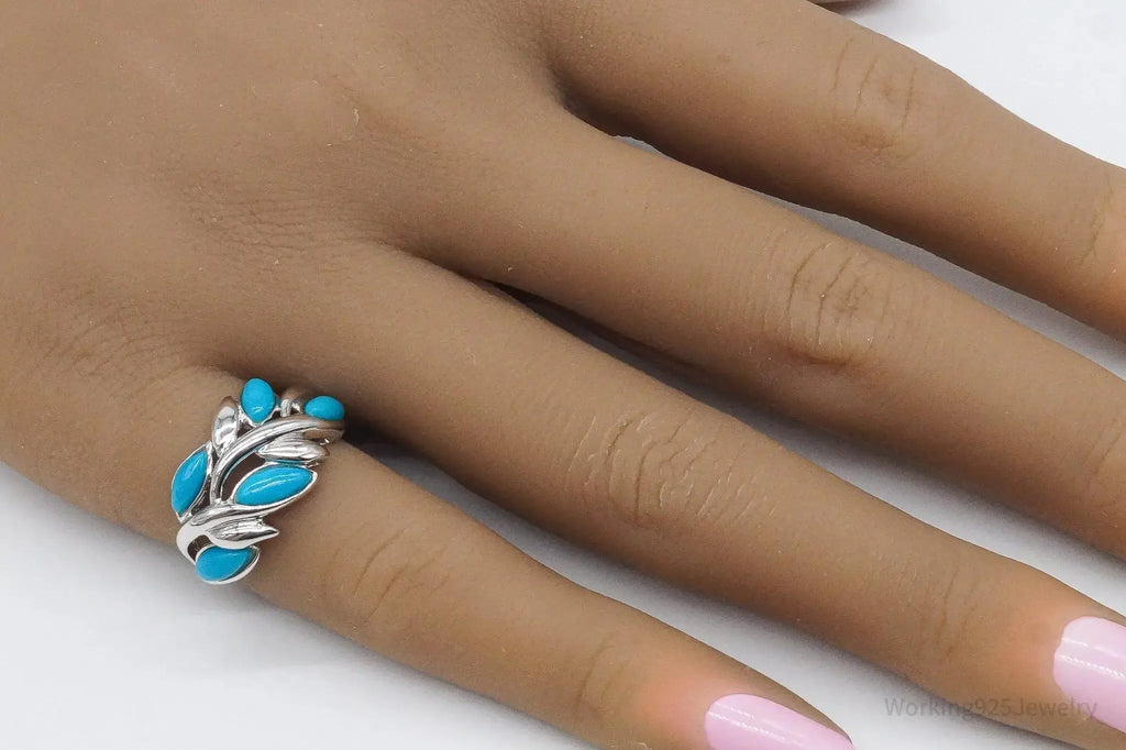 Vintage EA turquoise sterling silver ring, size 5, featuring a bold turquoise stone set in intricate sterling silver jewelry.
